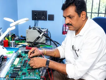 Technician testing an advanced circuit board